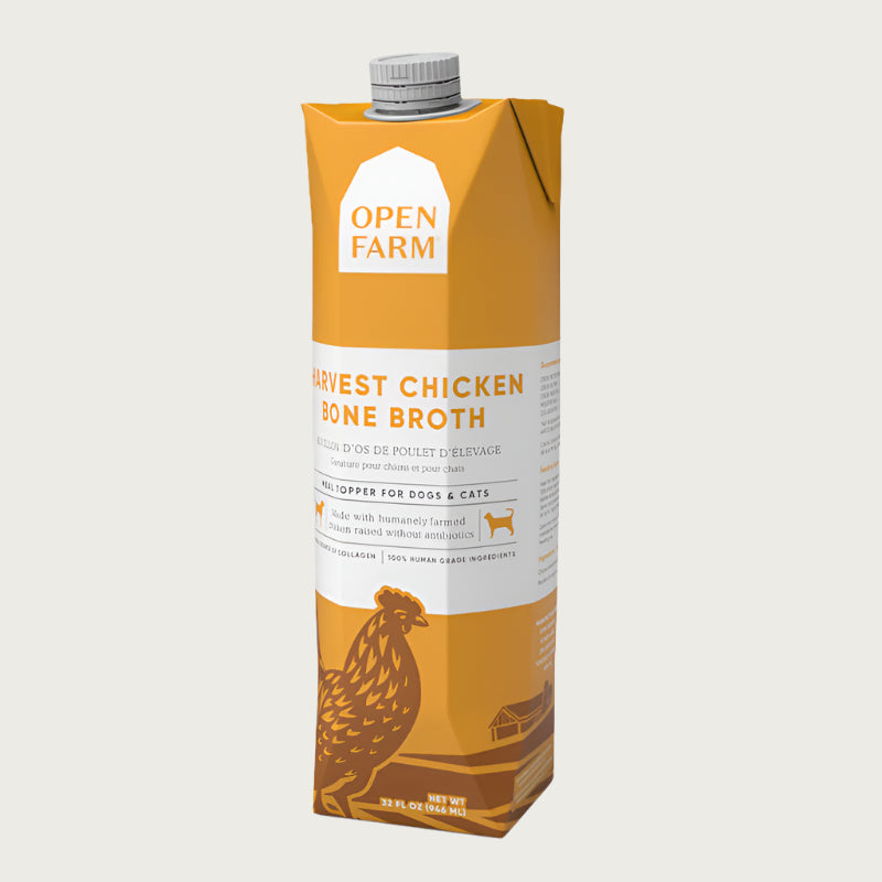 A 32 oz yellow & white carton with spout, of Open Farm Harvest Chicken Bone Broth Meal Topper for Dogs & Cats. 