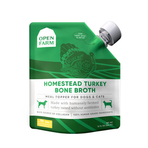 A 12 oz green & white pouch with spout, of Open Farm Homestead Turkey Bone Broth Meal Topper for Dogs & Cats. 