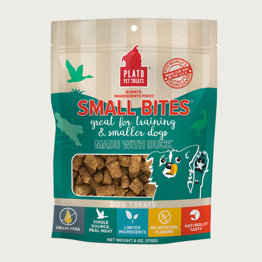6 oz green and tan bag of Plato Pet Treats Small Bites Made with Duck Dog Treats. Small clear window shows treats inside - small, brown, rectangular shaped treats.