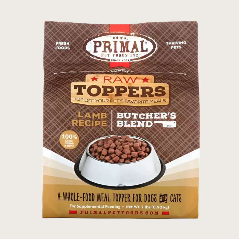 Primal Raw Toppers Butcher's Blend lamb recipe scoopable frozen raw whole food meal topper for dogs and cats, in a 2 pound bag. 