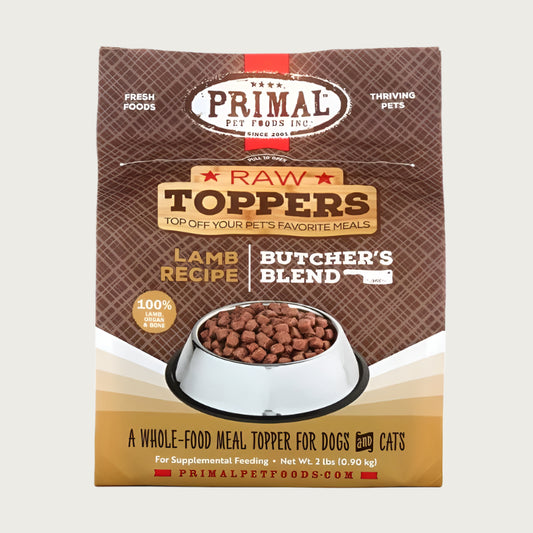 Primal Raw Toppers Butcher's Blend lamb recipe scoopable frozen raw whole food meal topper for dogs and cats, in a 2 pound bag. 