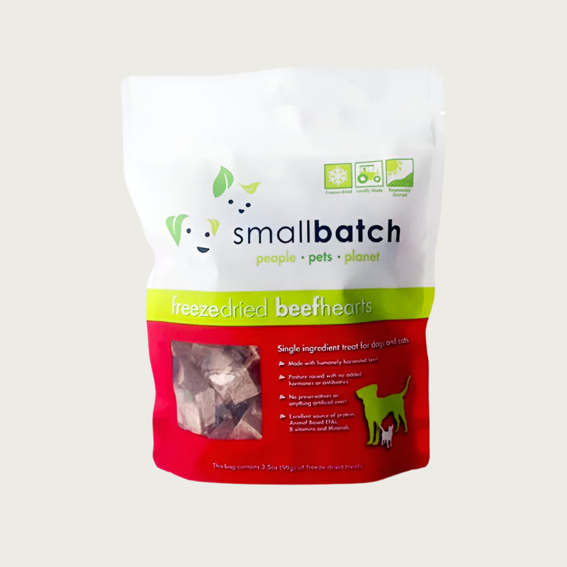 A red and white bag of Smallbatch freeze-dried raw beef heart treats for dogs and cats, 3.5 ounces. This is a single ingredient treat. The bag has a small, clear window showing cubed treat pieces.