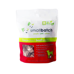 A red and white bag of Smallbatch freeze-dried raw beef heart treats for dogs and cats, 3.5 ounces. This is a single ingredient treat. The bag has a small, clear window showing cubed treat pieces.