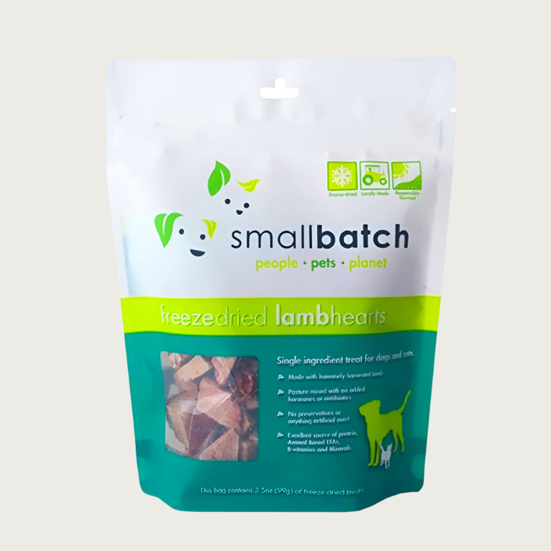 A teal and white bag of Smallbatch freeze-dried raw lamb heart treats for dogs and cats, 3.5 ounces. This is a single ingredient treat. The bag has a small, clear window showing cubed treat pieces.