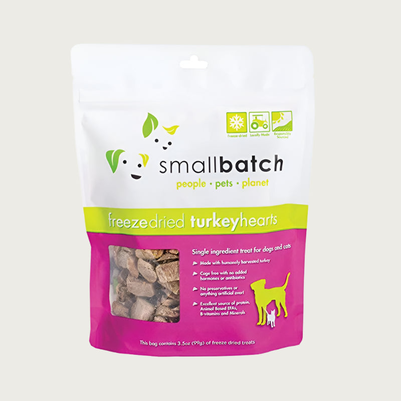 A hot pink and white bag of Smallbatch freeze-dried raw turkey heart treats for dogs and cats, 3.5 ounces. This is a single ingredient treat. The bag has a small, clear window showing cubed treat pieces.