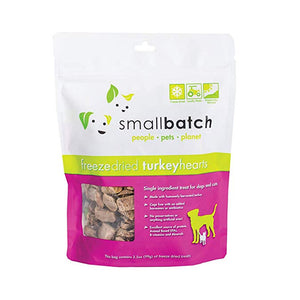 A hot pink and white bag of Smallbatch freeze-dried raw turkey heart treats for dogs and cats, 3.5 ounces. This is a single ingredient treat. The bag has a small, clear window showing cubed treat pieces.