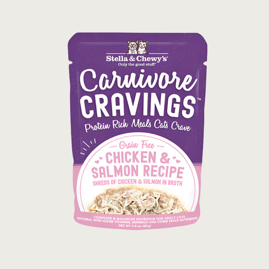 A 2.8 oz purple pouch of Stella & Chewy's Carnivore Cravings Savory Shreds, Chicken & Salmon Recipe in Tasty Broth for Cats. Small image on front shows shredded chicken & salmon.