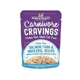 A 2.8 oz purple pouch of Stella & Chewy's Carnivore Cravings Savory Shreds, Salmon, Tuna & Mackerel Recipe in Tasty Broth for Cats. Small image on front shows shredded fish.