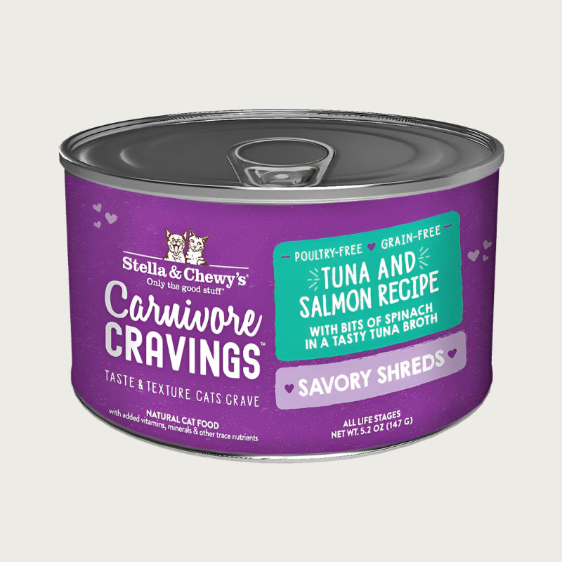 A 5.2 oz purple can of Stella & Chewy's Carnivore Cravings Savory Shreds, Tuna & Salmon Recipe, with bits of spinach in a tasty tuna broth for cats of all life stages.
