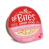 A 2.7 oz cup of Stella & Chewy's Lil' Bites Savory Stews Chicken & Chicken Liver Dinner in Broth, Mighty Meals for Small Breed Dogs. Shreds of chicken & chicken liver in rich broth. Packaging is a clear plastic cup with peel off lid. 