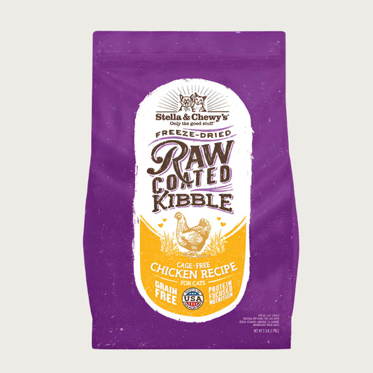 2.5 lb purple bag of Stella & Chewy's Freeze-Dried Raw Coated Kibble, Cage-Free Chicken Recipe for cats. Grain free, protein focused nutrition. A small illustration of a chicken is in the center of the bag.