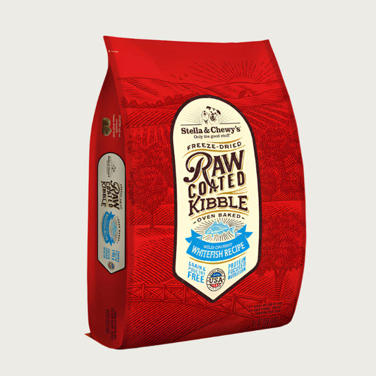 10 lb red bag of Stella & Chewy's Freeze-Dried Raw Coated Kibble, Oven Baked Wild-Caught Whitefish Recipe for dogs. Grain free, protein focused nutrition. A small illustration of a fish is in the center of the bag.