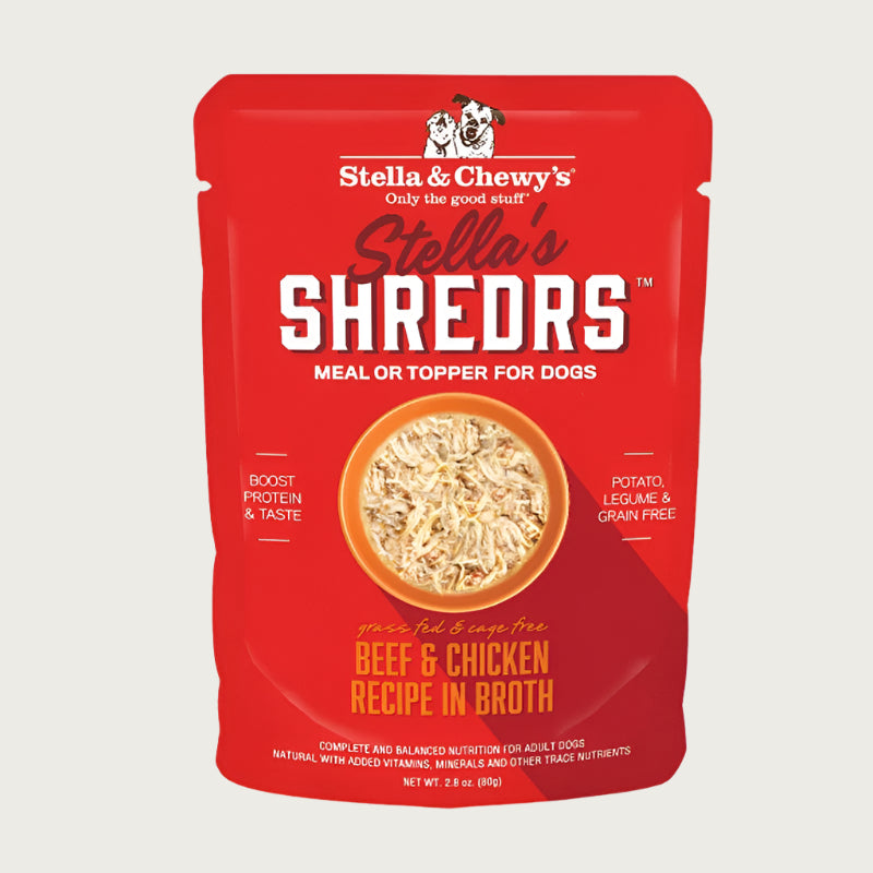 A 2.8 oz red pouch of Stella & Chewy's Stella's Shredrs Meal or Topper for Dogs, Beef & Chicken Recipe in Broth. Small image in center shows a bowl of shredded food.
