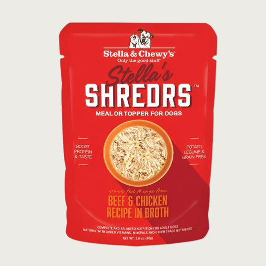 A 2.8 oz red pouch of Stella & Chewy's Stella's Shredrs Meal or Topper for Dogs, Beef & Chicken Recipe in Broth. Small image in center shows a bowl of shredded food.
