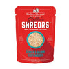 A 2.8 oz red pouch of Stella & Chewy's Stella's Shredrs Meal or Topper for Dogs, Chicken & Salmon Recipe in Broth. Small image in center shows a bowl of shredded food.