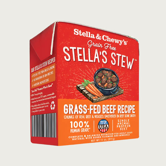 An 11 oz red & orange carton of Stella & Chewy's Grain Free Stella's Stew, Grass-Fed Beef Recipe for Dogs. Single animal protein diet, chunks of real beef & veggies smothered in beef bone broth. 100% human grade. Corners of box fold up, to open carton from perforated top edge.