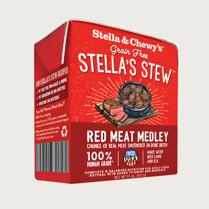 An 11 oz red & maroon carton of Stella & Chewy's Grain Free Stella's Stew, Red Meat Medley Recipe for Dogs.  Chunks of real meat & veggies smothered in bone broth. 100% human grade. Corners of box fold up, to open carton from perforated top edge.