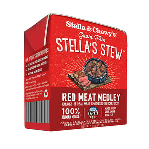 An 11 oz red & maroon carton of Stella & Chewy's Grain Free Stella's Stew, Red Meat Medley Recipe for Dogs.  Chunks of real meat & veggies smothered in bone broth. 100% human grade. Corners of box fold up, to open carton from perforated top edge.