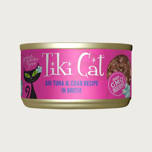 A 2.8 oz can with pull-top lid, of Tiki Cat Ahi Tuna & Crab Recipe in Broth wet food for cats. Small image on can shows minced pieces of tuna and shreds of crab. Grain & potato free and non GMO ingredients.