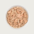 Load image into Gallery viewer, Close-up photo of a dish of Tiki Cat Wild Salmon & Chicken Recipe. Dish is full of shredded chicken and topped with large flakes of salmon.
