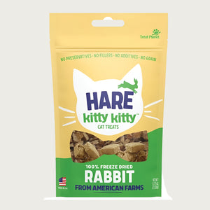 0.75 oz yellow and green bag with white cat face silhouette, of Hare Kitty Kitty 100% freeze dried rabbit cat treats. From American farms.