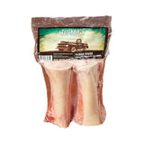 Shrink wrapped package of 2 - 6" beef marrow bones from Tucker's. Bones are visible, and have meat attached. 
