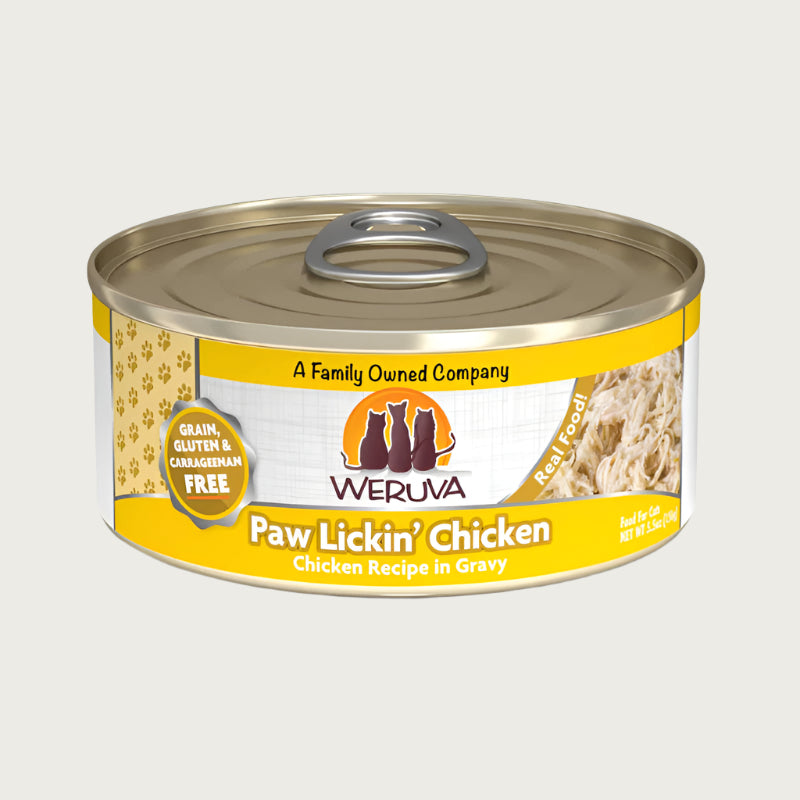 A 5.5 oz can with pull-top lid, of Weruva Paw Lickin' Chicken, chicken recipe in gravy wet food for cats. Image on can shows actual food, which is just shreds of chicken.