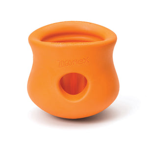 Tangerine (orange) colored Toppl toy. It has a cupped shape, with a slight indent on the top 1/3 of the toy, just under its lip. There is a round opening in the center, and the top of the toy is completely open. There are vertical ridges inside it.
