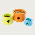 Load image into Gallery viewer, A view from the top, of all three sizes of the Toppl toy, to show how they look with food and treats inside.

