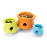 A view from the top, of all three sizes of the Toppl toy, to show how they look with food and treats inside.