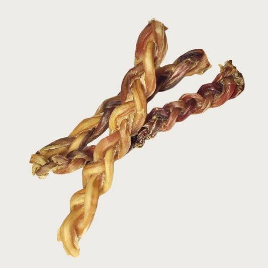 Group of three 12in braided bully dog chews stacked closely to show an example of color & size variation.