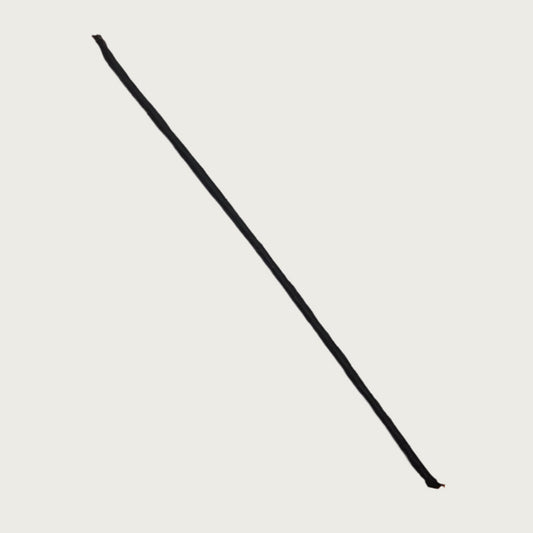 Dark brown joy stick dog chew. It looks like a long, straight, thin tree branch.