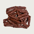 Load image into Gallery viewer, Close-up photo of a small stack of Wet Nose Beef Smokies dog treats. They are reddish brown links, measuring about 2.5" long.
