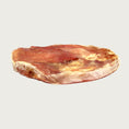 Load image into Gallery viewer, Side view of the Bully Disc dog chew to show thickness.
