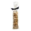 2.25 oz clear cellophane, tube-shaped bag of Wet Nose exclusive Bunny Drops dog treats, tied with black ribbon. Treats inside are pale brown in color, and shaped like pebbles of various sizes.