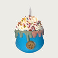 Load image into Gallery viewer, Cup shaped, blue dog toy, with whipped cream layered on top. There are multicolored sprinkles and a candle on top of the whipped cream. Dripping about halfway down the sides of the toy, is an edible, decorative drip design moving down from the rim of the toy.
