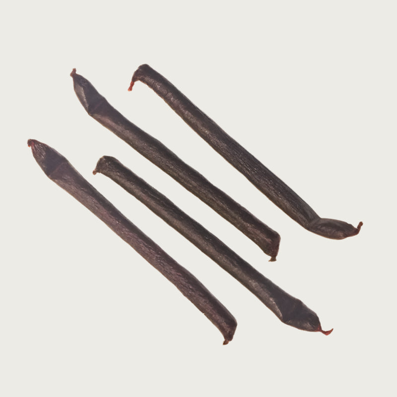 Four chicken links, side by side. They look like dark reddish brown sausages.