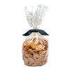 1 lb clear cellophane bag of Wet Nose exclusive Chicken Nuggets dog treats, tied with black ribbon. Coin-shaped treats inside are a pale orangey-tan color.