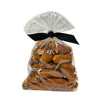 7 oz clear resealable bag of Wet Nose exclusive, Chicken Smokies dog treats, tied with black ribbon. Product inside is light brown colored links. 