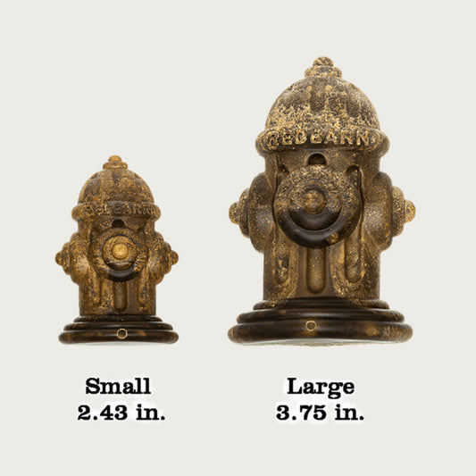 Small and large fire hydrant-shaped dental chews, side by side. Small measures 2.43 in long and Large measures 3.75 in long.