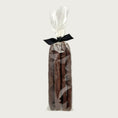 Load image into Gallery viewer, Clear cellophane bag of 5 count Wet Nose exclusive Duck Sticks dog treats, tied with black ribbon. 7"-8" sized reddish/brown sticks. 
