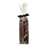 Clear cellophane bag of 5 count Wet Nose exclusive Duck Sticks dog treats, tied with black ribbon. 7"-8" sized reddish/brown sticks. 