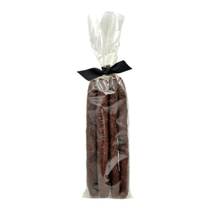 Clear cellophane bag of 5 count Wet Nose exclusive Duck Sticks dog treats, tied with black ribbon. 7"-8" sized reddish/brown sticks. 