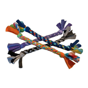A variety of four small fleece tug dog toys from Wet Nose. They are in a rainbow of color combinations. Toys are tightly knotted & twisted, with thick knots at each end. Loose fleece hangs off the ends like a candy wrapper.
