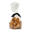 10 oz clear, cellophane bag of Wet Nose exclusive, Goobers dog treats, tied with black ribbon. Visible inside are 3" long, tan cookies with swirl texture on top.