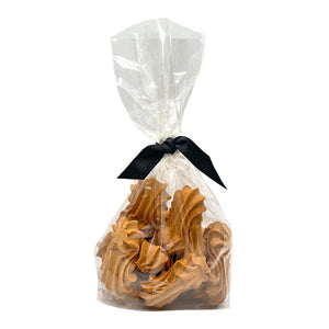 10 oz clear, cellophane bag of Wet Nose exclusive, Goobers dog treats, tied with black ribbon. Visible inside are 3" long, tan cookies with swirl texture on top.