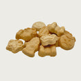 Load image into Gallery viewer, Closeup photo of a small stack of My Favorite Things dog treats. They are tan, and in different shapes; paw print, fire hydrant, dog bone, ball, and food bowl. Each cookie measures about 1" wide.
