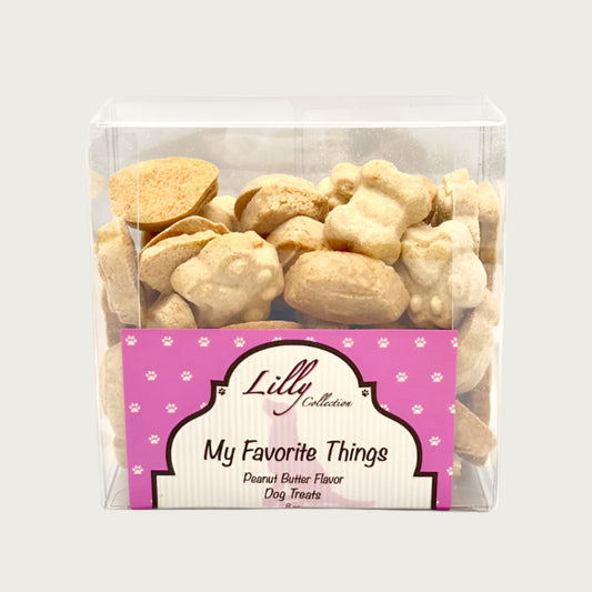 8 oz clear box of Wet Nose Lilly Collection My Favorite Things Peanut Butter Flavor Dog Treats. Treats inside are tan, and have different shapes.