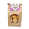 16 oz brown craft paper bag of Wet Nose Lilly Collection Woof! Waffles Peanut Butter Flavor Dog Treats. Clear window on bag shows tan, round and flat, cookies inside.