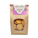 16 oz brown craft paper bag of Wet Nose Lilly Collection Woof! Waffles Peanut Butter Flavor Dog Treats. Clear window on bag shows tan, round and flat, cookies inside.